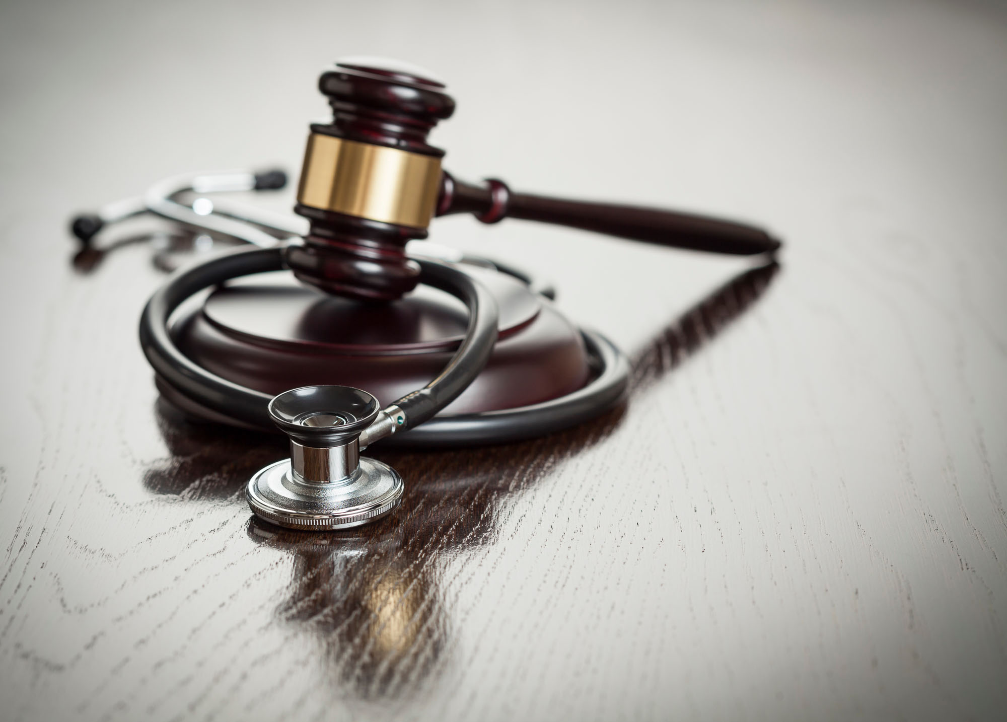Image of a gavel and stethoscope representing medical negligence